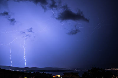 Low angle view of lightning in sky at night