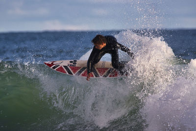 Man splashing water in sea