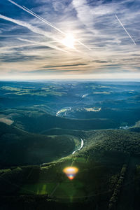 Aerial view of landscape against sky during sunset