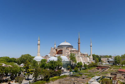 Low angle view of mosque against clear blue sky hagia sophia
