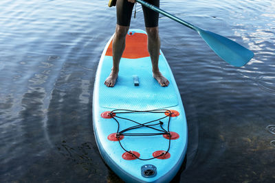 High angle view of man rowing boat in sea