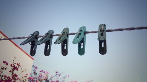 Low angle view of hanging against clear sky
