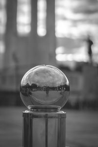 Close-up of glass ball against blurred background
