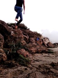 Woman standing on rock