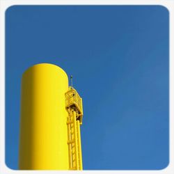 Low angle view of built structure against clear blue sky