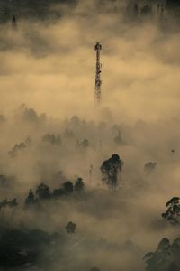 Low angle view of communications tower against sky