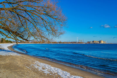 Scenic view of sea against clear blue sky