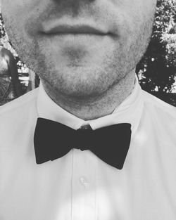 Midsection of man wearing bow tie during wedding