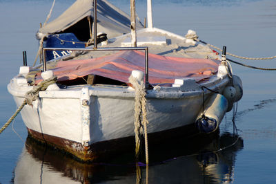 Fishing boat moored on lake