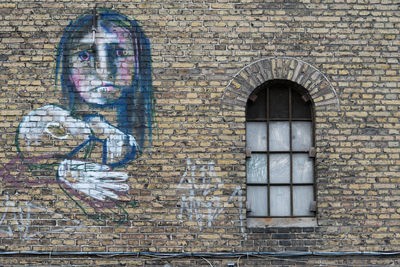 Close-up of window on brick wall