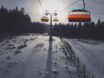 Ski lift over snow covered field