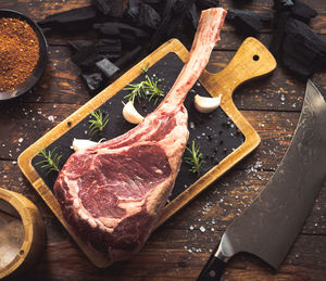 High angle view of meat on cutting board