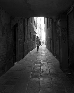 People walking in corridor of building