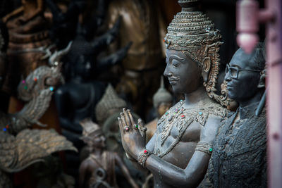 Statue of buddha against building