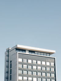 Low angle view of modern building against clear sky