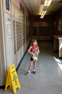 Full length of cute girl standing on floor