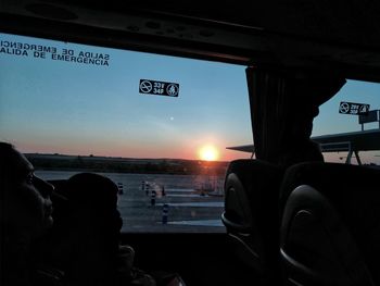 View of bus stop through car window