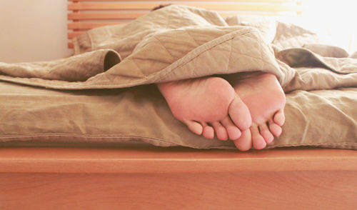 View of feet under bedding