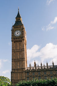 Low angle view of clock tower against sky