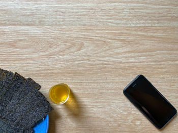 High angle view of smart phone on table