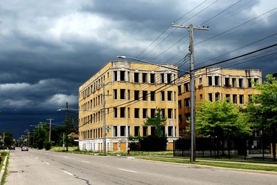 Street by road against sky