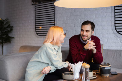 Young couple dating at restaurant