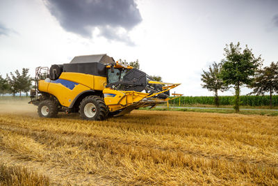 Tractor on field against sky