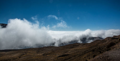 Panoramic view of volcanic landscape against sky