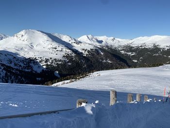 Scenic view of snowcapped mountains against sky