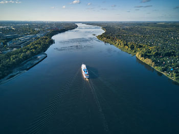 Ship moving on volga river against sky