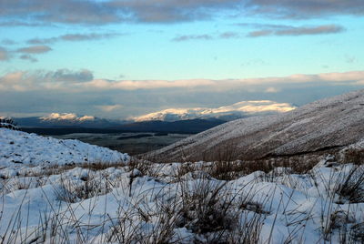 Scenic view of frozen lake against sky