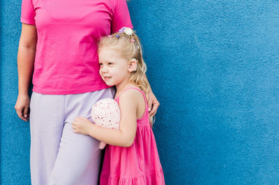 Rear view of girl with mother