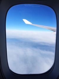 Scenic view of cloudscape seen through airplane window