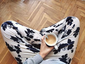 High angle view of coffee cup on floor