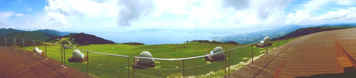 Panoramic view of landscape against cloudy sky