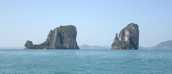 Panoramic view of sea against clear blue sky