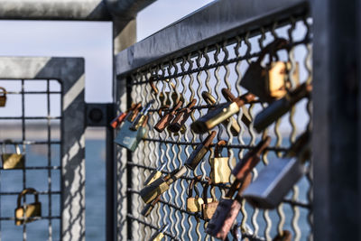 Close-up of padlocks on fence