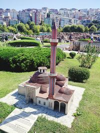 Built structure in garden against buildings in city