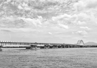 Bridge over sea against sky