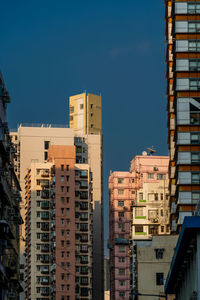 Buildings in city against sky