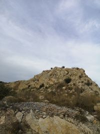 Rock formations on land against sky