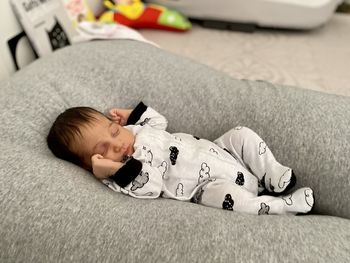 Portrait of a newborn sleeping on the breastfeeding pillow at home