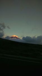 Scenic view of landscape against cloudy sky