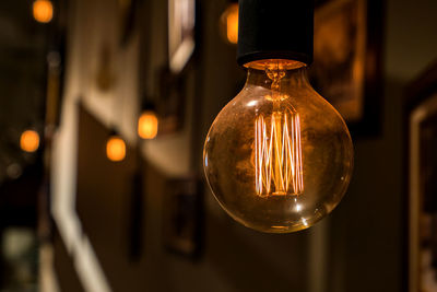 Close-up of illuminated light bulb