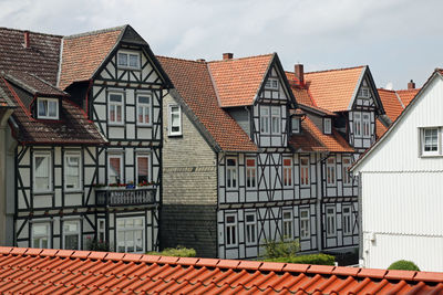 Houses against sky in city