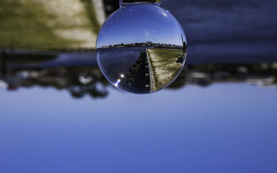 Close-up of crystal ball on water
