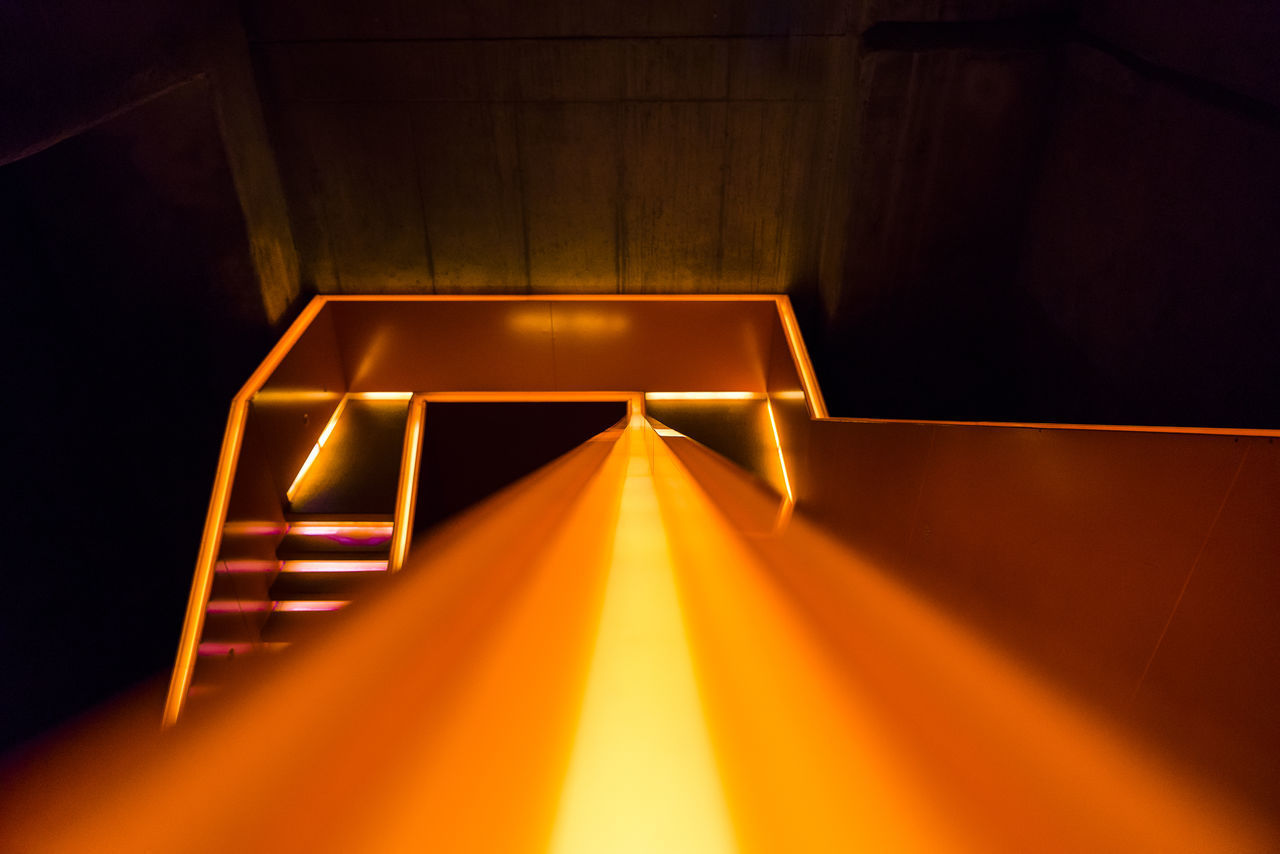 HIGH ANGLE VIEW OF ILLUMINATED STAIRCASES IN BUILDING