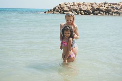 Portrait of happy girl in sea