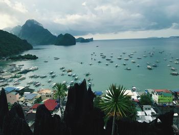 High angle view of boats in sea against sky