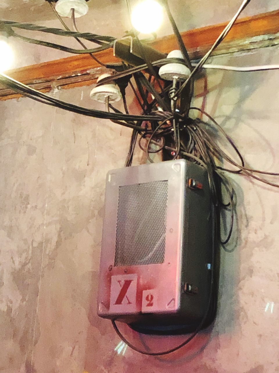 CLOSE-UP OF TELEPHONE ON WALL